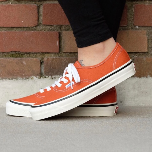 orange vans on feet